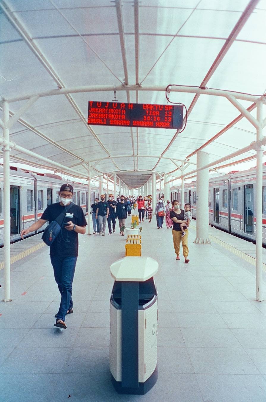 Commuters Walking Through Transit Station