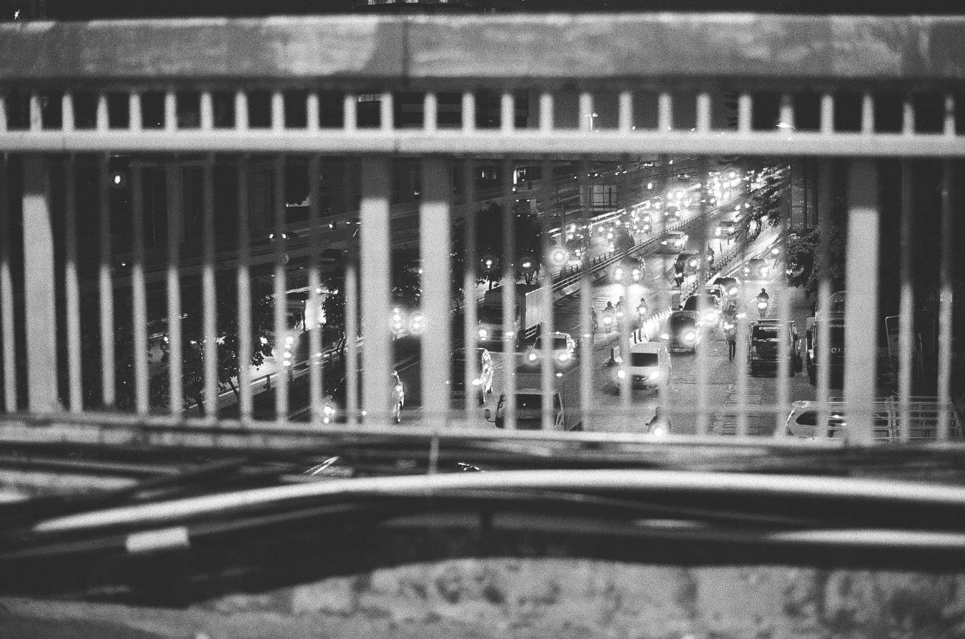 Night Traffic Through Overpass Bars