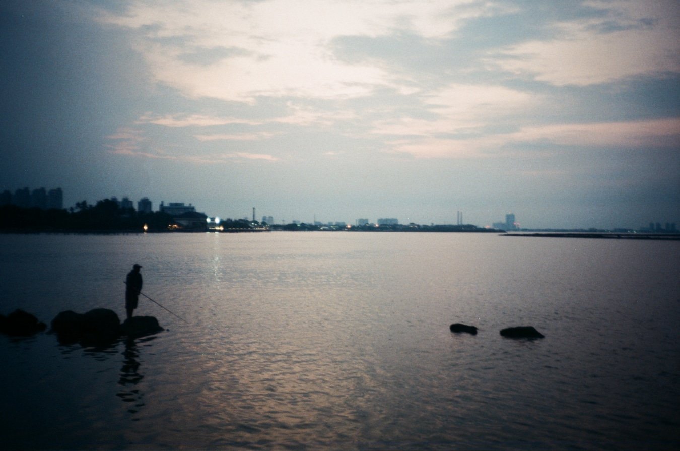 Olympus Mju I sample photo: Solitary Evening Fisherman by the Harbour