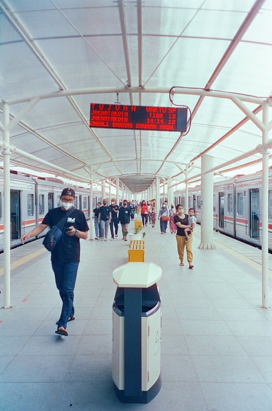 Commuters Walking Through Transit Station. Shot with Olympus Mju II, Hoasca 800 film