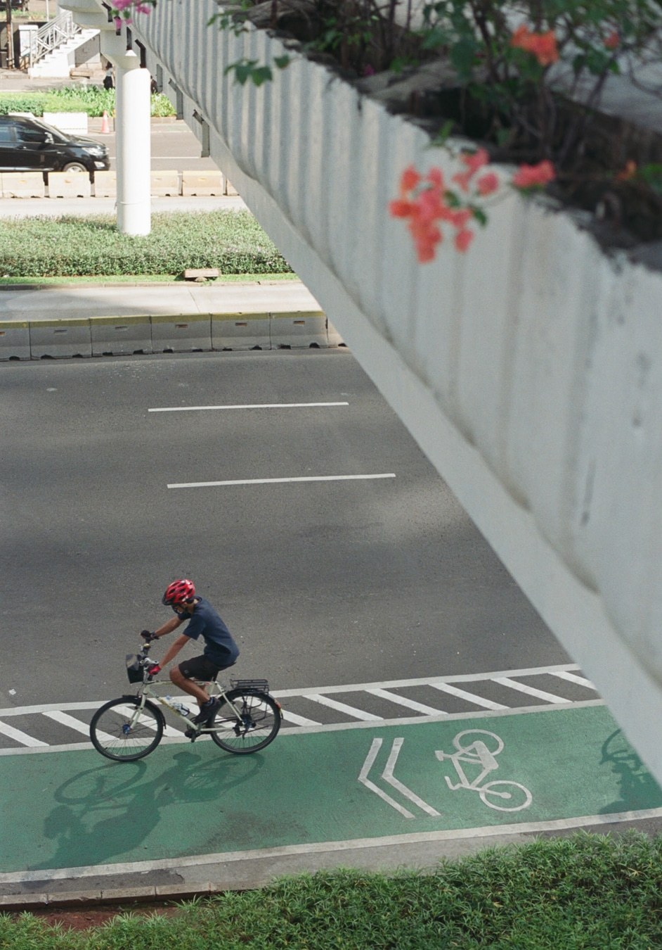 Morning Cyclist on Urban Bike Lane. Shot with Olympus OM-1, Olympus Zuiko 50mm f/1.8, Kodal Gold 200 film