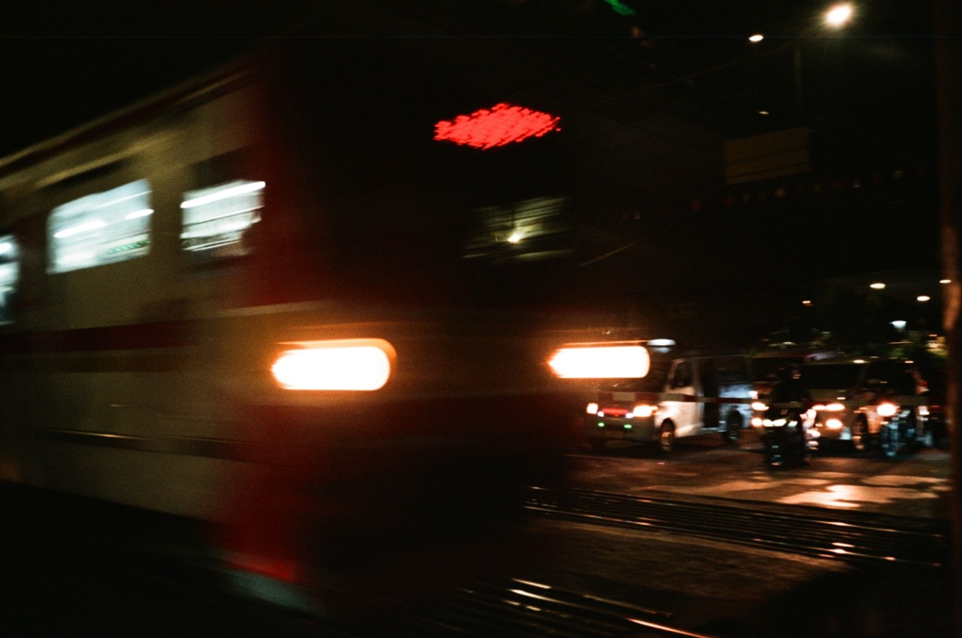 Night Train Passing at Jakarta Railway Crossing. Shot with Olympus Mju I, Kodal Gold 200 film